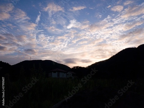 Fototapeta sunset over the mountain