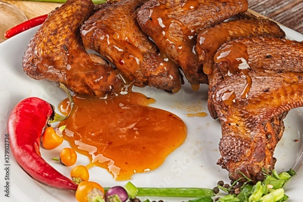 Fototapeta Composition with smoked chicken wings on the table