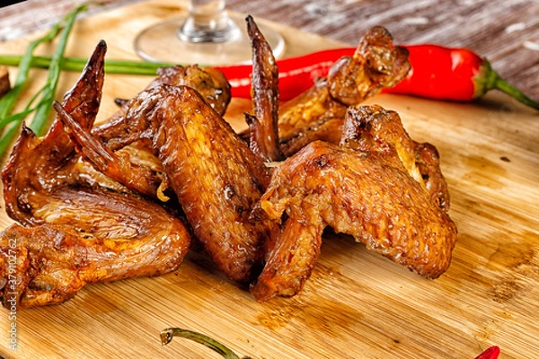 Fototapeta Composition with smoked chicken wings on the table