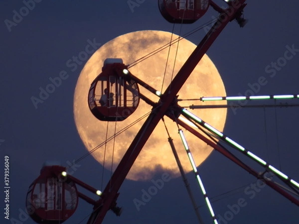 Obraz 金色の満月と観覧車のシルエット