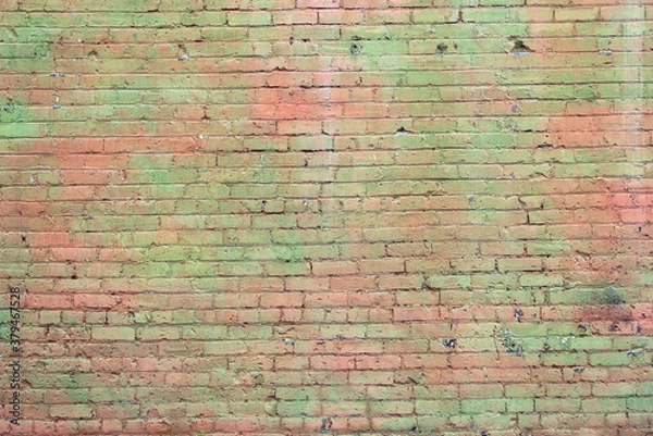 Fototapeta old brick wall with faded green paint