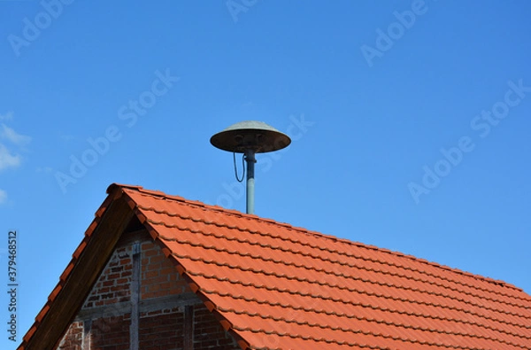 Obraz Sirene auf Hausdach