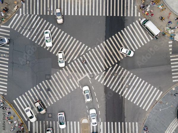 Fototapeta Drone aerial view of cross road with people and traffic cars in downtown. Business concept. Busy traffic in rush hour. Pedestrian walking in the street. Crowded of people urban street Shanghai China