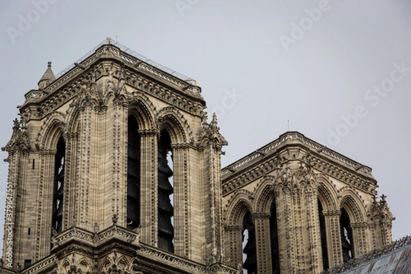 Fototapeta Notre Dame Cathedral tower with medieval ornaments erected high