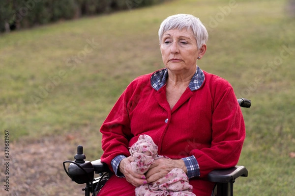 Obraz portrait of a senior caucasian woman in wheelchair, sad expression