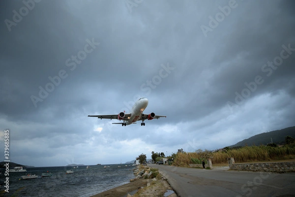 Obraz 9/14/2020 Greece, Skiathos island, airport. Dangerous plane landing.