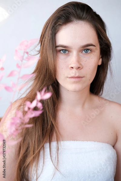 Obraz portrait of a girl in a spring mood, pink flowers