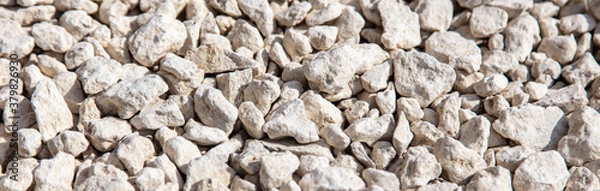Fototapeta Stone gravel at a construction site as a background.