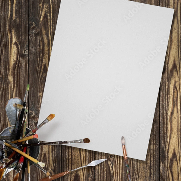 Obraz Canvas and brush placed on the desk