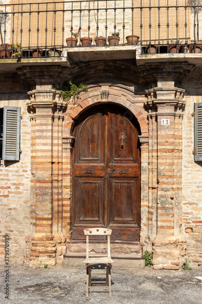 Obraz detail of the entrance of a building with a chair in front, Offida, Ascoli Piceno, Umbria, Italy