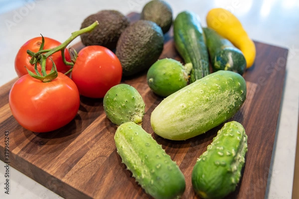 Fototapeta vegetables on butcher block cutting board