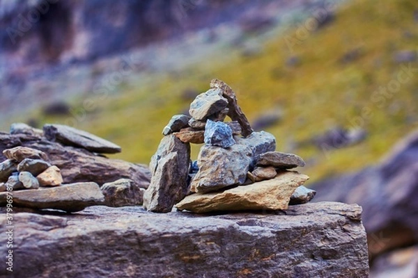 Fototapeta pile of stones in the mountains