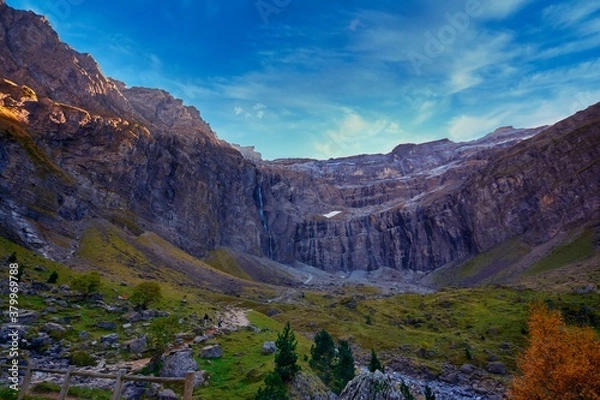 Fototapeta Cirque de Gavarnie in France with some pine trees in the front