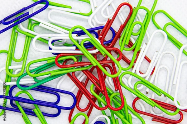 Fototapeta colored paper clips on white