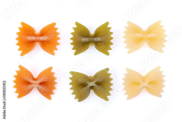 Fototapeta Color Farfalle - dry pasta isolated on a white background. A variety of types and forms of Italian pasta.