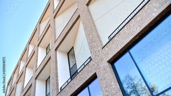 Obraz Multistoried modern, new and stylish living block of flats. Newly built apartment building.