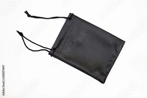 Fototapeta Black case. Small black pouch. Small bag. Clutch with black laces. Pouch and laces.