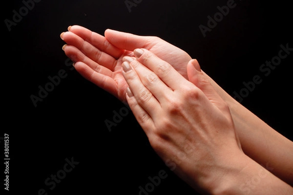 Obraz Female hands clapping on black, side-view