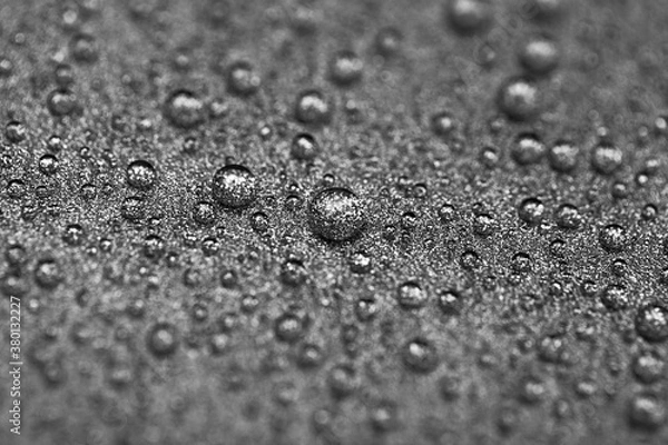 Fototapeta Abstract gray texture with water drops and metal surface close-up. Beautiful bright droplets shot with selective focus.