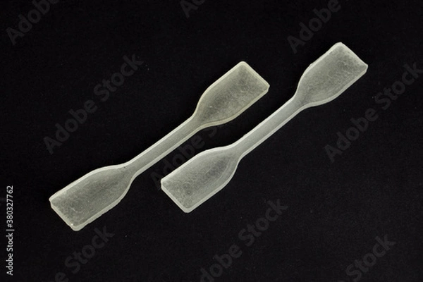 Fototapeta polydimethylsiloxane (pdms) polymer sample which is using in engineering experiments. it is a tensile test specimen to examine the strength of the material.