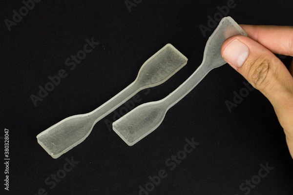 Fototapeta polydimethylsiloxane (pdms) polymer sample which is using in engineering experiments. it is a tensile test specimen to examine the strength of the material.