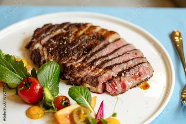 Obraz Ribeye beef steak with fresh vegetable salad