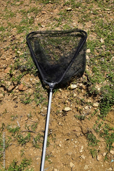 Obraz rake on the shore of the lake for fishing