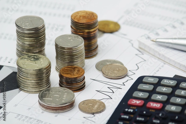 Fototapeta Russian coins with different economic graphs and charts