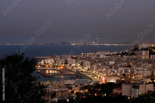 Fototapeta High cityscape on algiers coast in a cloudy night