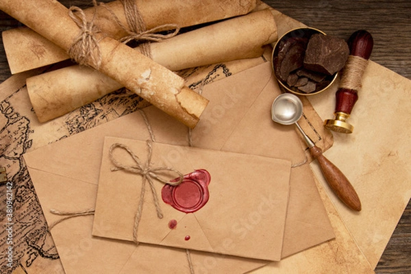 Obraz The old letter is sealed with sealing wax and a seal in an envelope. Scrolls with a wax seal.