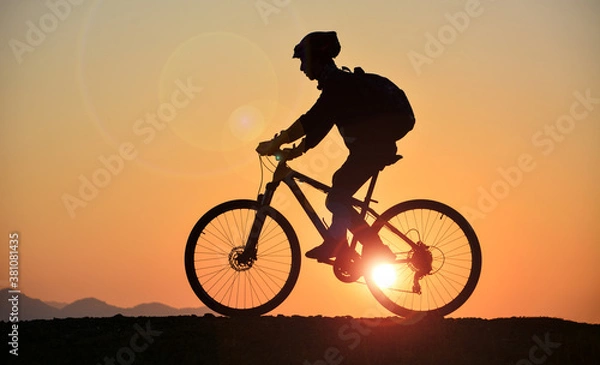 Obraz silhouette of a person riding a bicycle