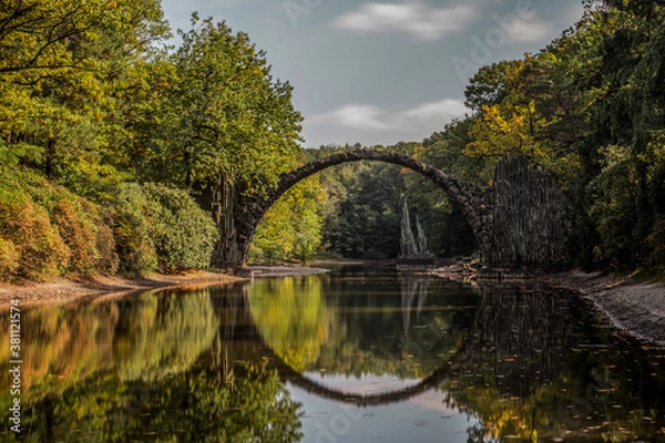 Fototapeta Ancient stone bridge in water reflection