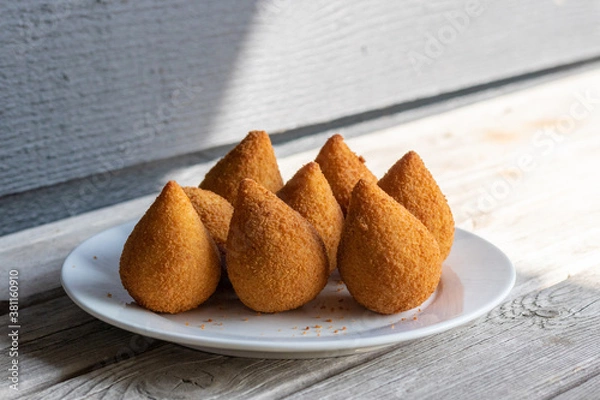 Fototapeta Coxinhas, brazilian snacks party food, nicely served in a plate