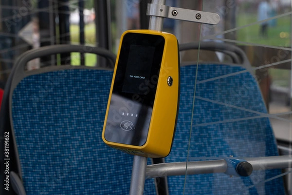 Fototapeta NFS Validator on the bus. Terminal for contactless payment of bus fare.