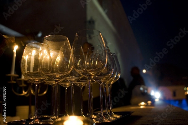 Fototapeta A set of wineglasses at a luxurious party in the night