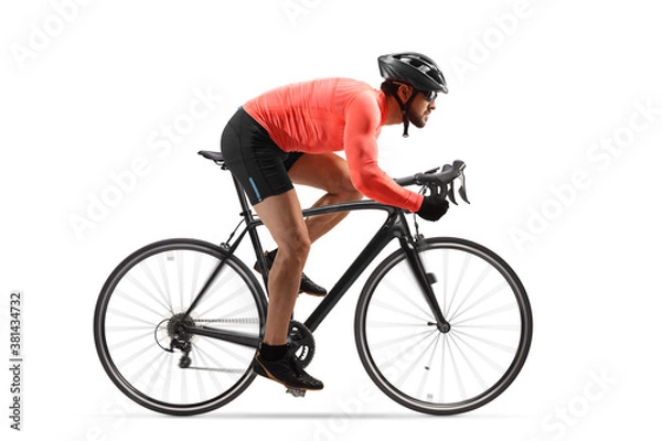 Obraz Profil strzał mężczyzny rowerzysty jeżdżącego na rowerze szosowym z kołowrotkami
