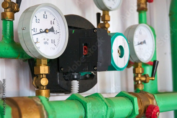Obraz Pressure sensors on the hot water supply line indicate pressure.