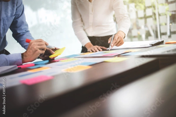 Fototapeta Business sales consultant discussing in data documents at modern office.