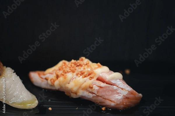 Obraz Grilled or burned salmon sushi