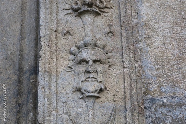 Fototapeta image of a man, decoration on a stone wall