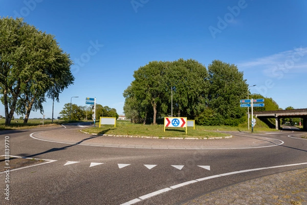 Fototapeta The roundabout on the van Pallandtlaan at the exit and highway ramp of the A44 motorway in the south-holland village of Sassenheim in the netherlands.