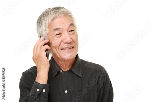 Obraz senior man with a smart phone