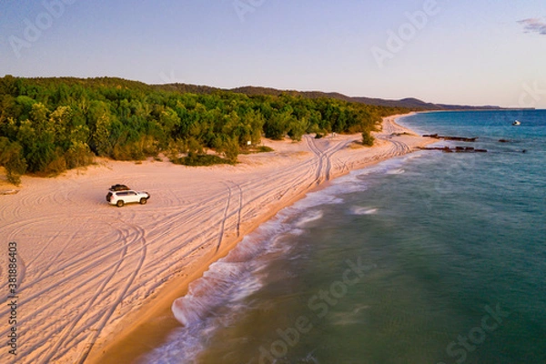 Obraz 4WD vehicle at sunset on Moreton Island