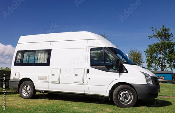 Fototapeta Side view of campervan on meadow - Coromandel, North Island, New Zealand