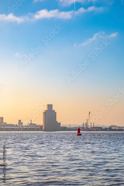 Fototapeta Liverpool, UK. Beautiful colorful long exposure shot of river Mersey from Albert Dock with smooth reflections of night lights from the other side of a shore. 