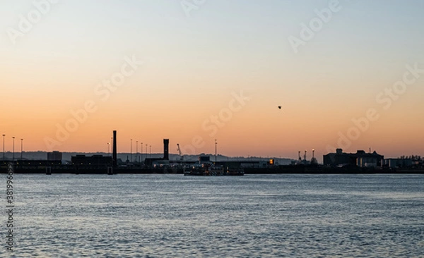 Fototapeta Liverpool, UK. Beautiful colorful long exposure shot of river Mersey from Albert Dock with smooth reflections of night lights from the other side of a shore. 