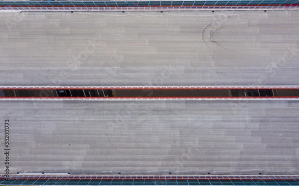 Fototapeta aerial top view of road construction site. building of new city highway. drone image. new road construction site