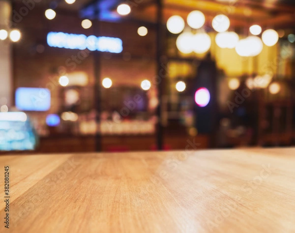 Fototapeta Table top counter with Bar Restaurant interior Blur background