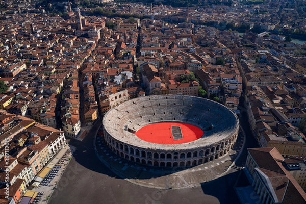 Fototapeta Aerial view of Arena di Verona, Italy. Flying over the historic city center. Photographing with drone. The Arena at Piazza Brà in Verona, is a famous Roman amphitheater. Verona, northern Italy.