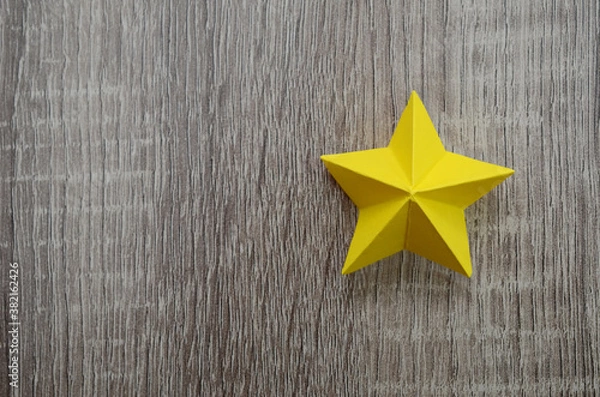 Obraz A folded yellow paper star